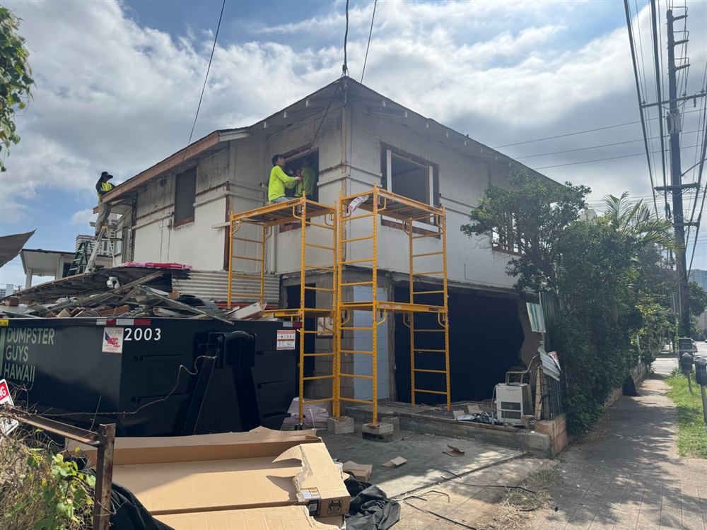 Crew on scaffolding during a whole-home renovation